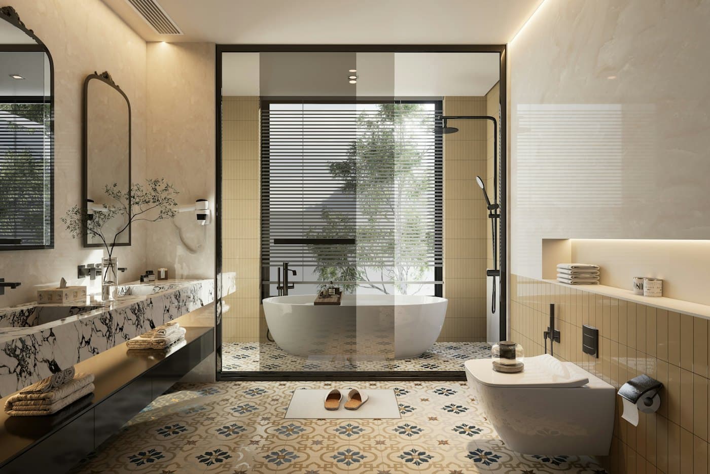 Bathroom with patterned floor tiles, a freestanding bath behind glass and a stone vanity