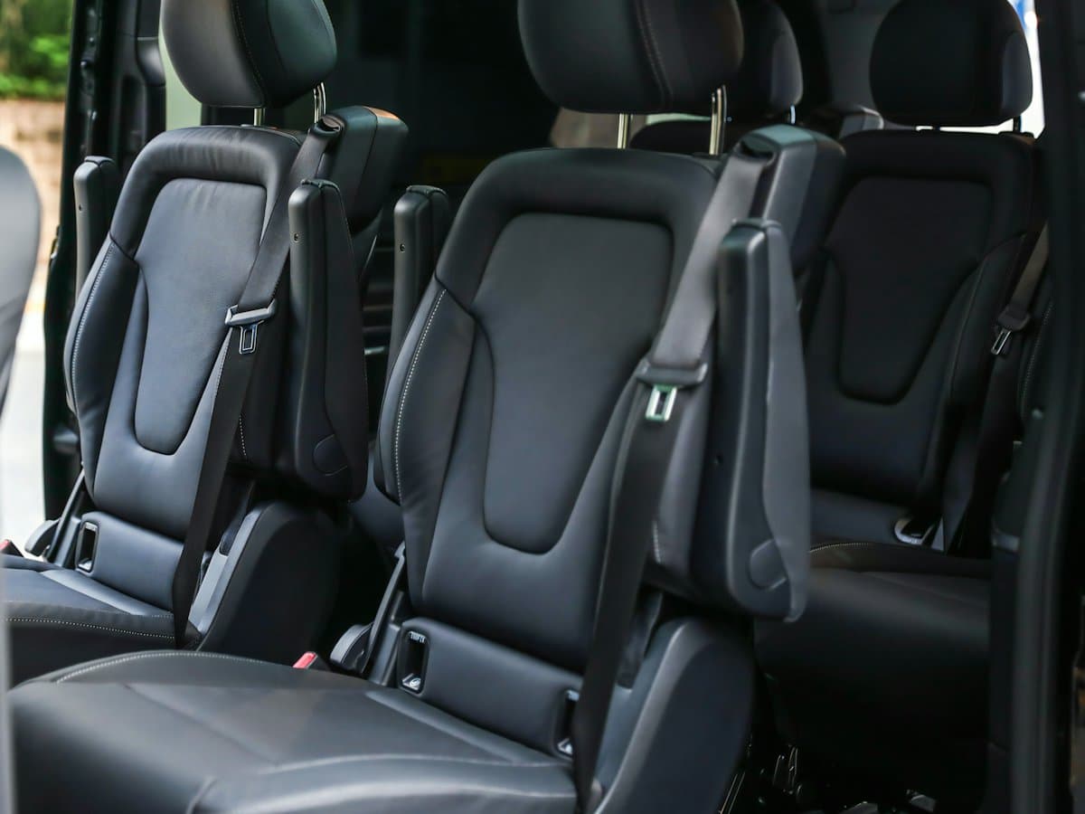 Black leather captain seats inside a passenger van